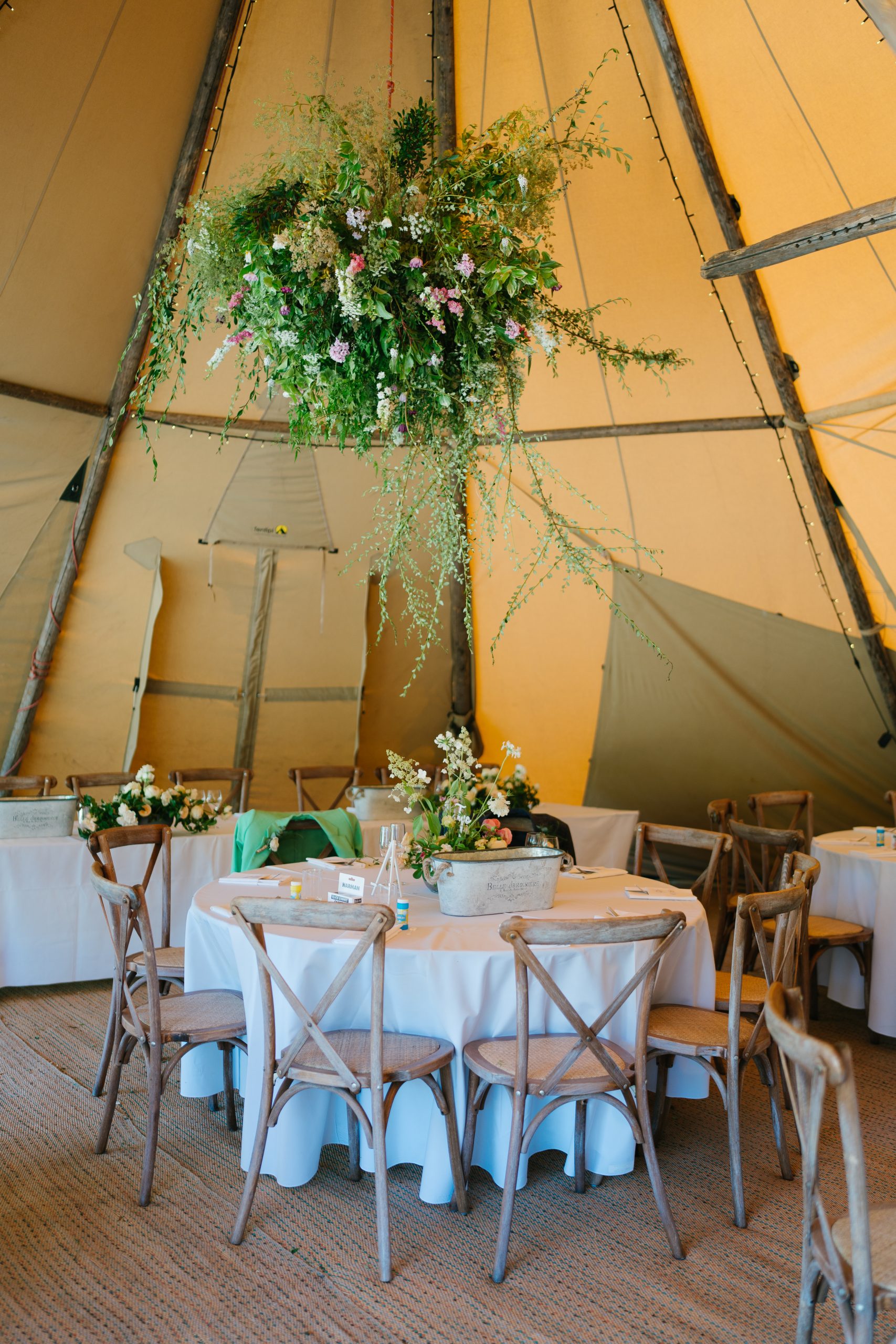 Tipi Wedding Venue, Quex. Image of table set under a Tipi, for a Tipi outdoor wedding.