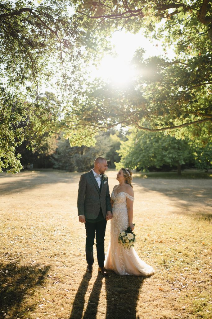 Spring Wedding - Quex Venue. Two newly-weds in the golden hour sun,