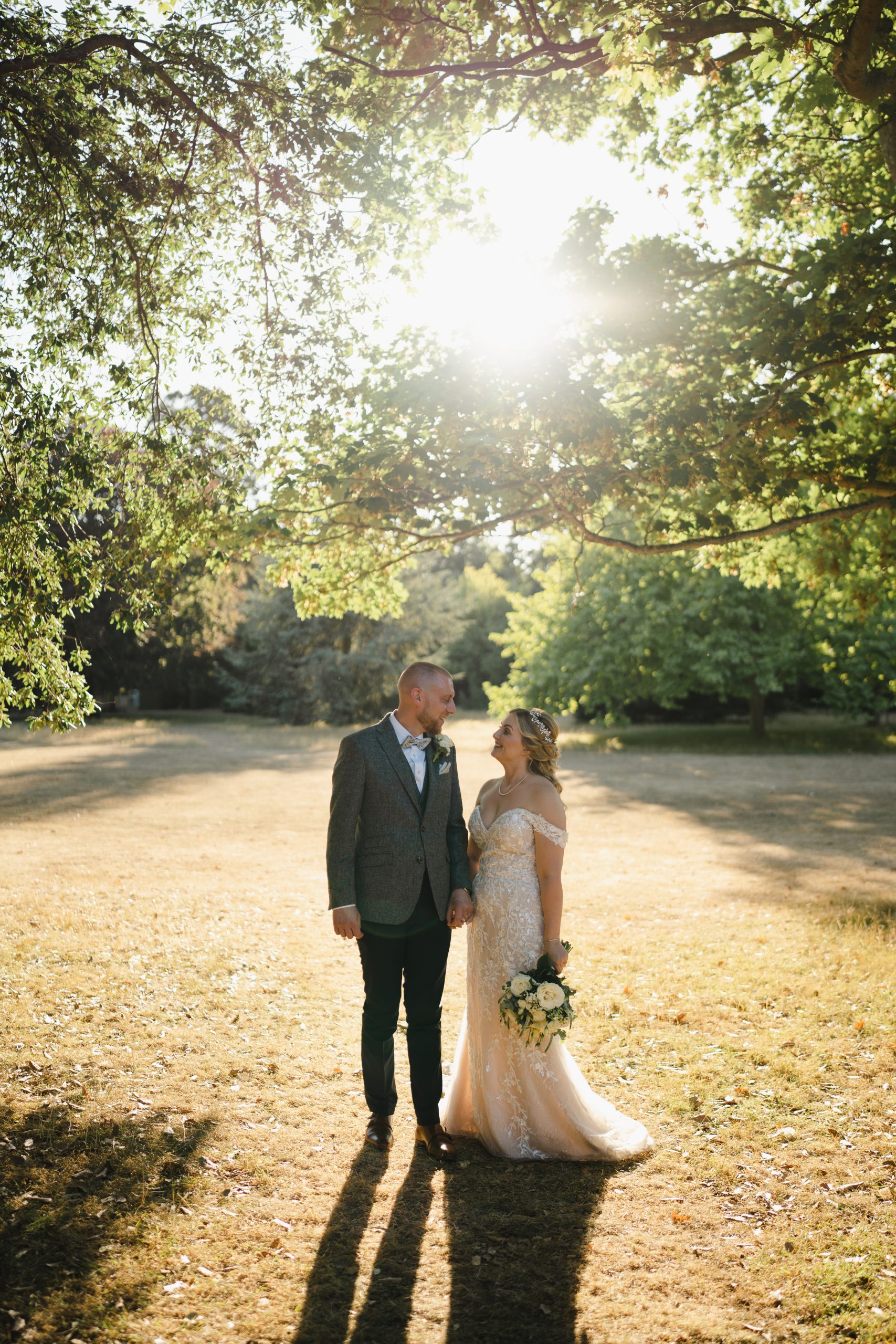 Spring Wedding - Quex Venue. Two newly-weds in the golden hour sun,